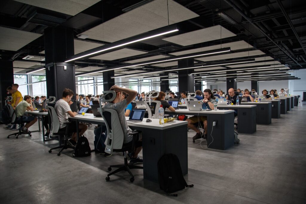 office with desks laptops