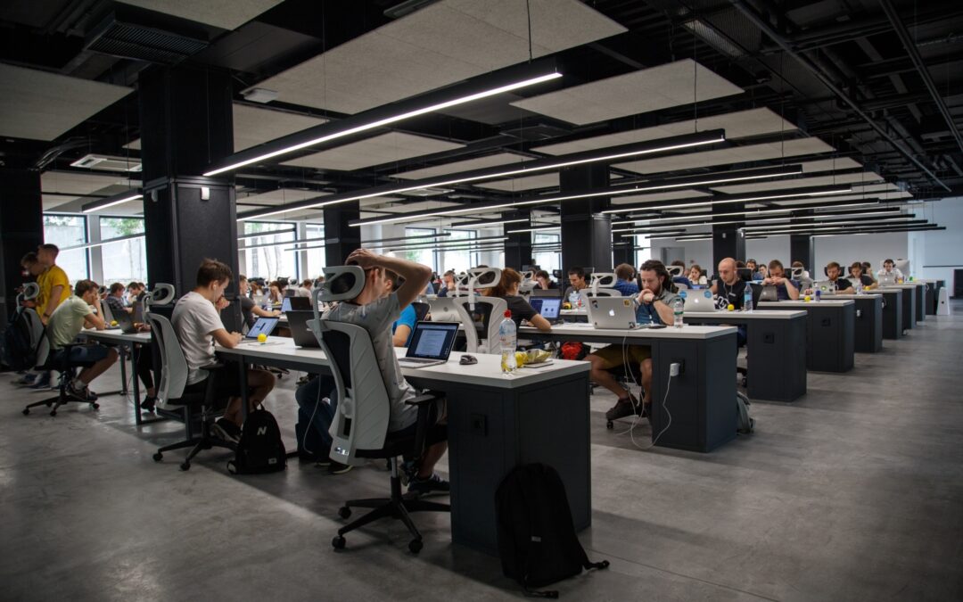 office with desks laptops